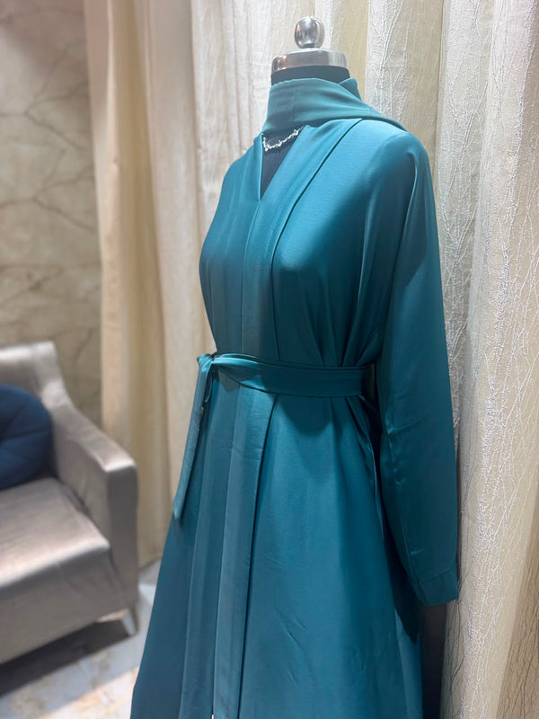 Our premium wrap-style abaya comes with matching dupatta + waist belt for that perfect modest silhouette.