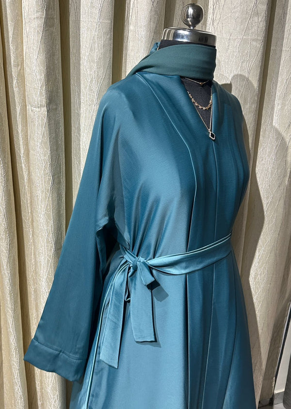 Our premium wrap-style abaya comes with matching dupatta + waist belt for that perfect modest silhouette.